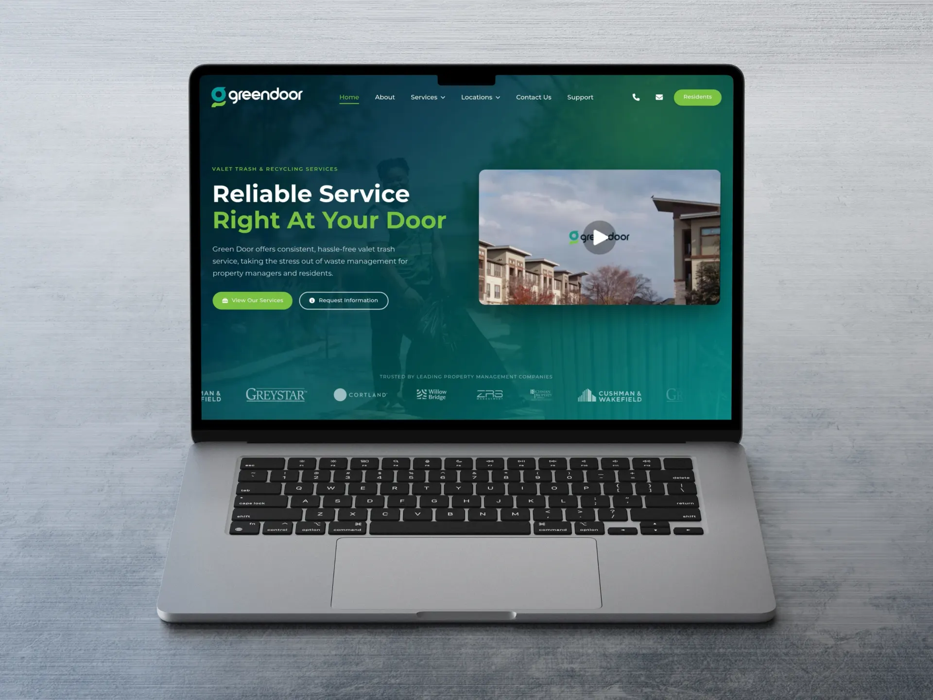 Green Door website homepage on a laptop