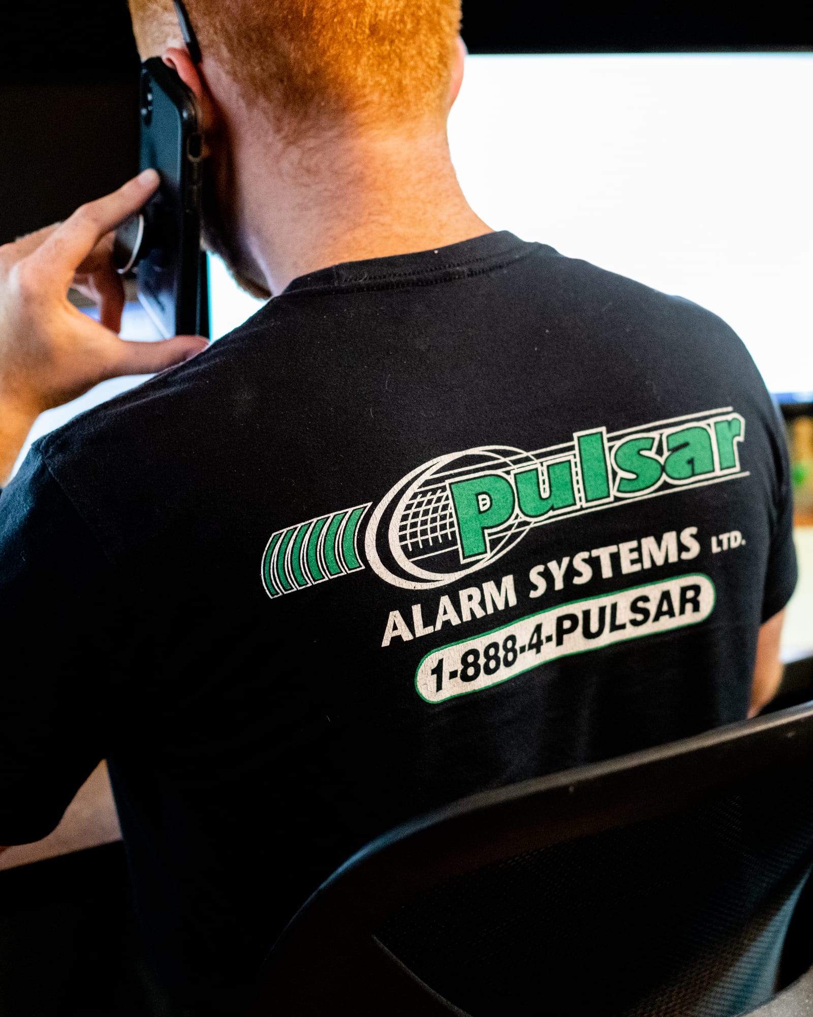 A Pulsar team member taking a call at the dispatch desk